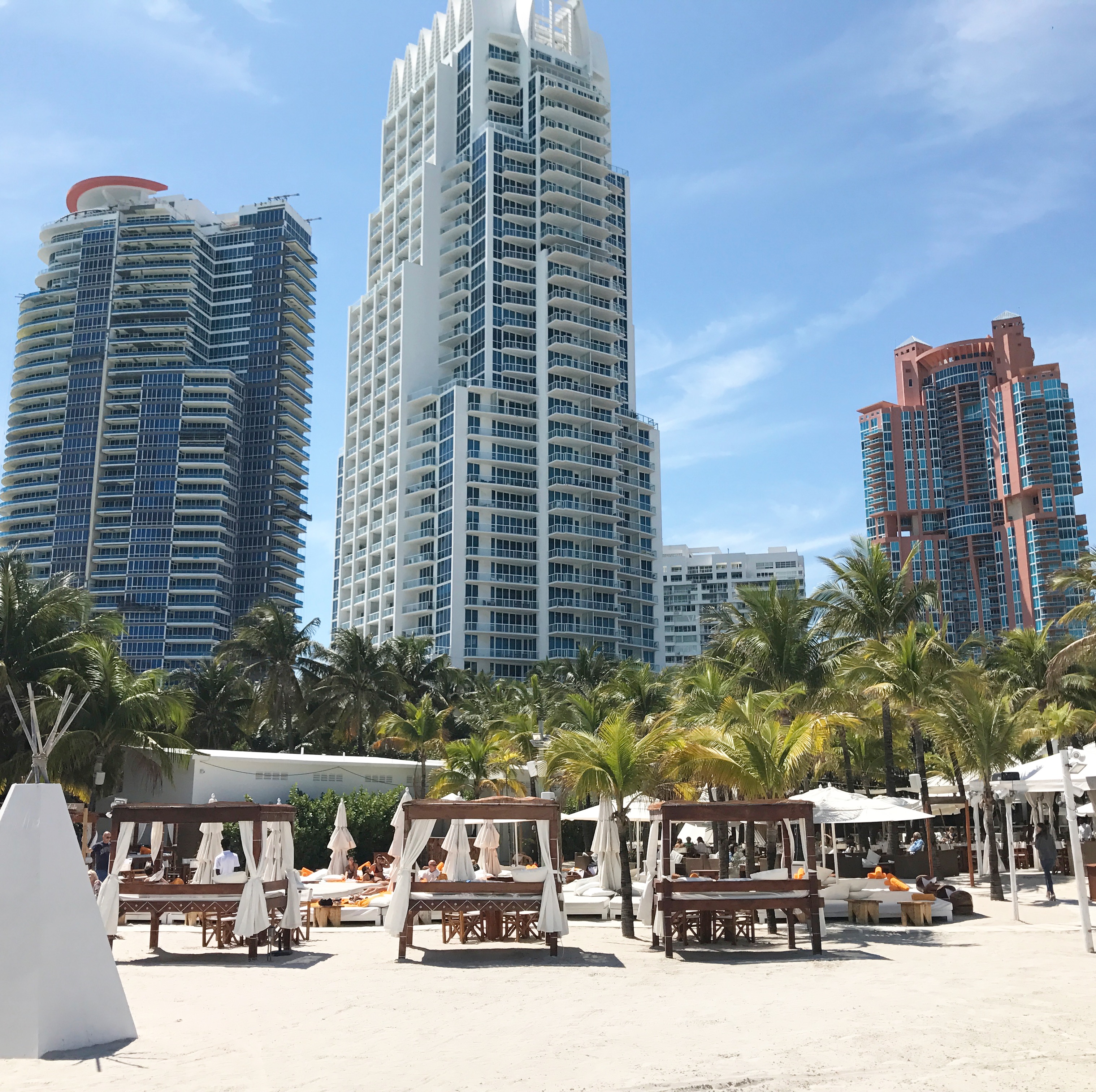 Beach cabanas and luxury condominium towers along the South of Fifth oceanfront
