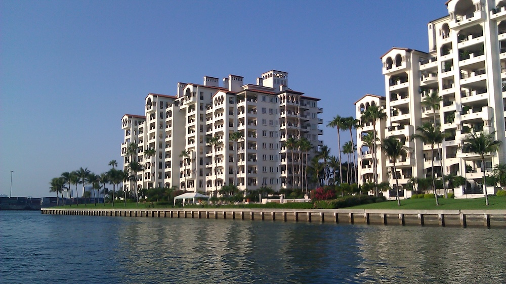 Fisher Island condominium building with marina and bay views